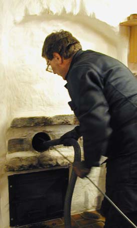 This type of stove is in the ;living room but fed from the kitchen adn dates back to teh middle ages